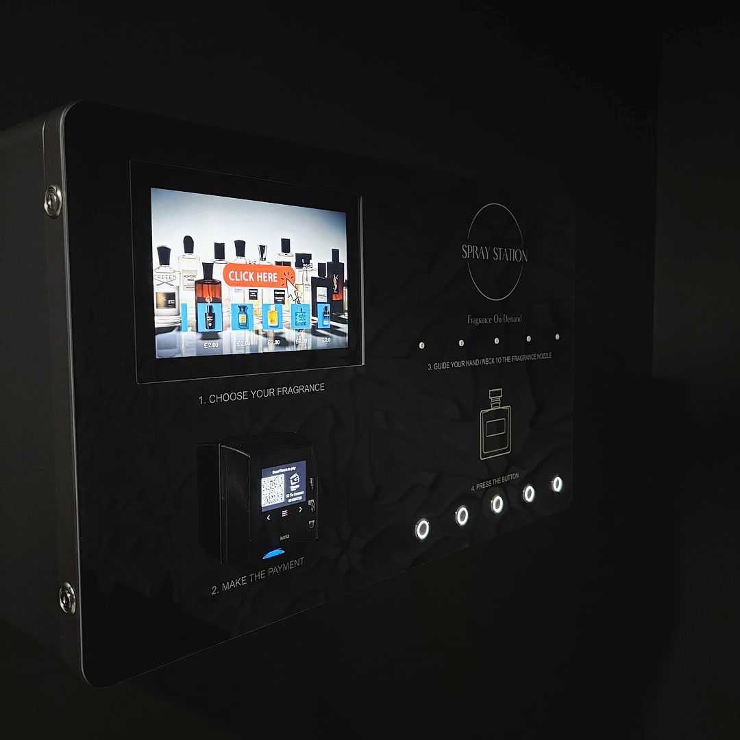 Spray Station wall-mounted perfume vending machine installed in a venue