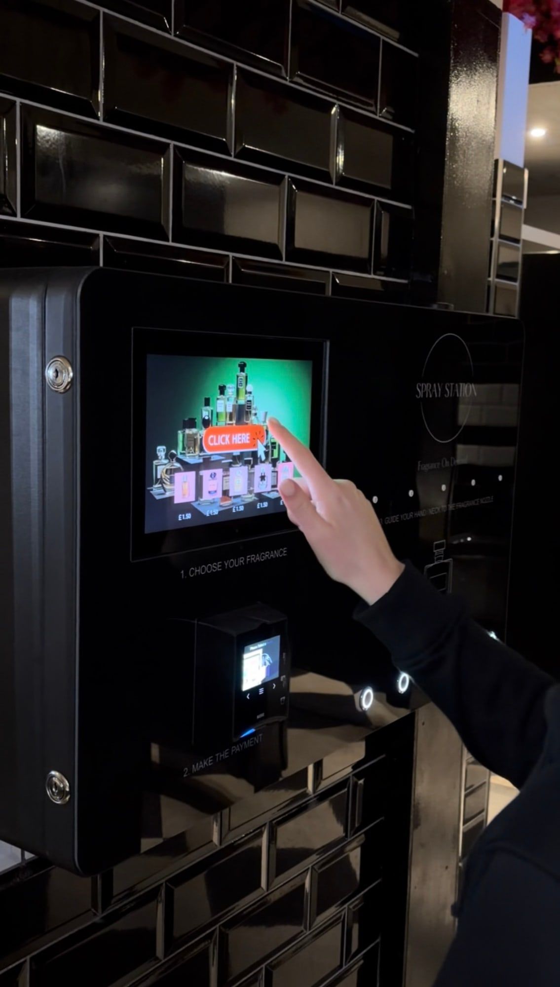 Customer selecting a fragrance on the Spray Box touchscreen