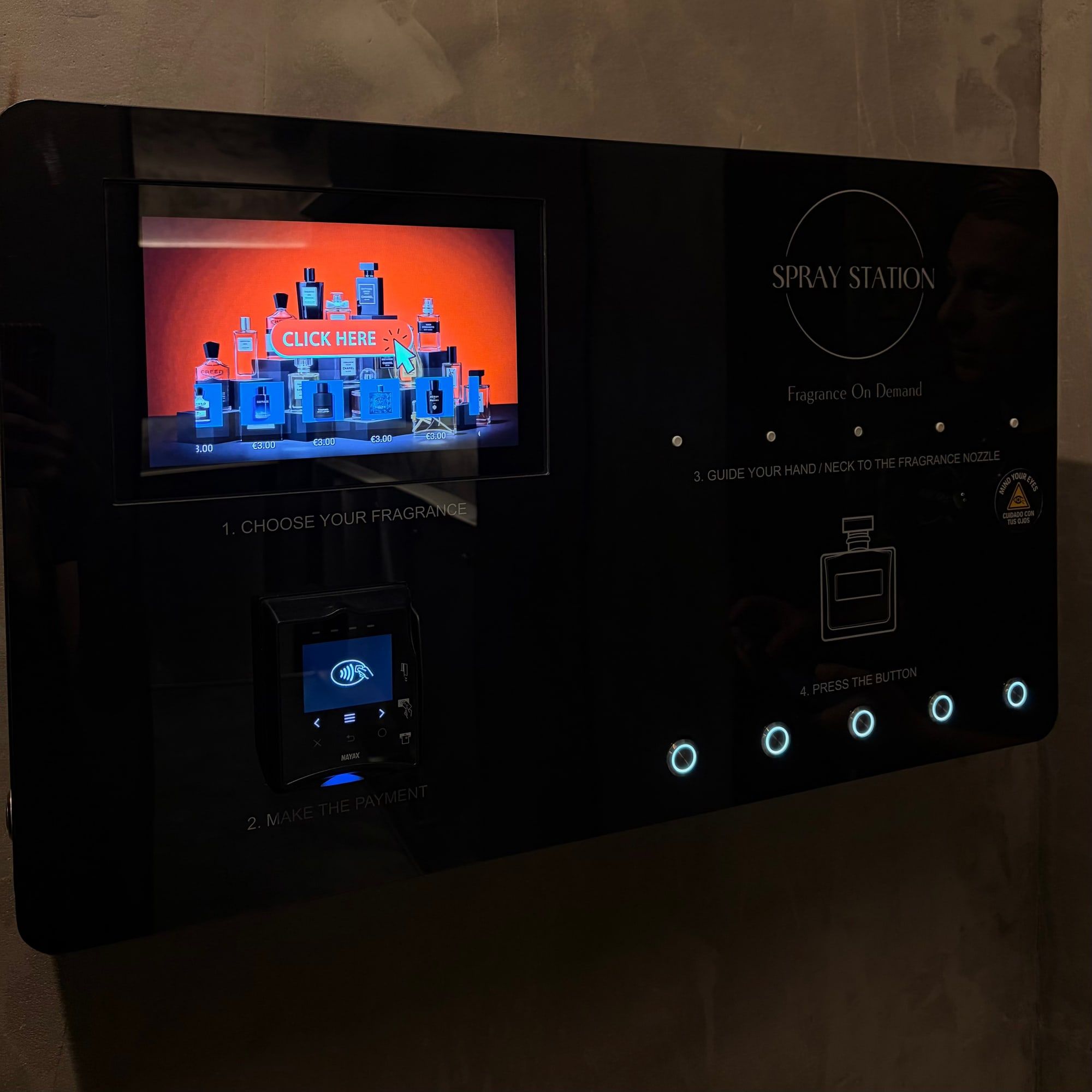 Spray Box with an illuminated screen on a stone wall